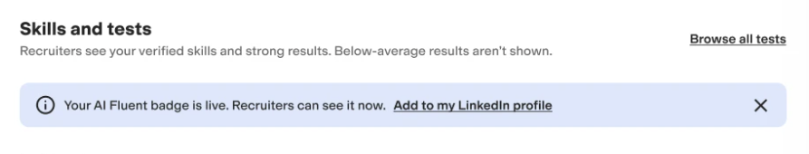 A banner in the Skills and Tests section of the profile confirming that the AI Fluency badge is live, with an optional link to share the badge to a LinkedIn profile. 